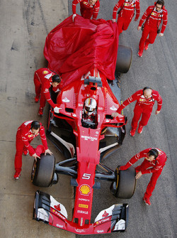 Sebastian Vettel, Ferrari, returns to the pits with a car problem