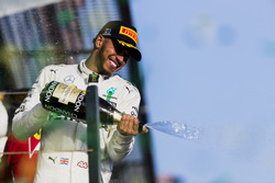 Lewis Hamilton, Mercedes AMG, 2nd Position, sprays Champagne from the podium