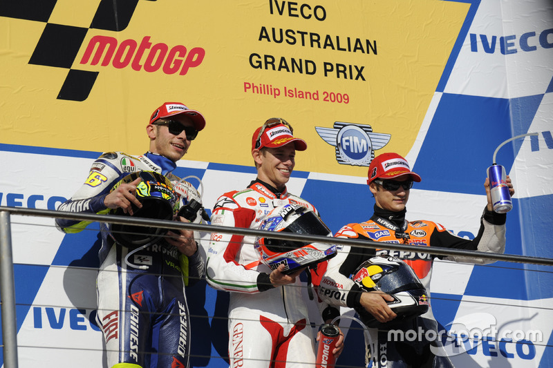 Podium: second place Valentino Rossi, Yamaha; Race winner Casey Stoner, Ducati; third place Dani Pedrosa, Repsol Honda