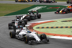 Felipe Massa, Williams FW38 Mercedes, leads Fernando Alonso, McLaren MP4-31 Honda, and Nico Hulkenbe
