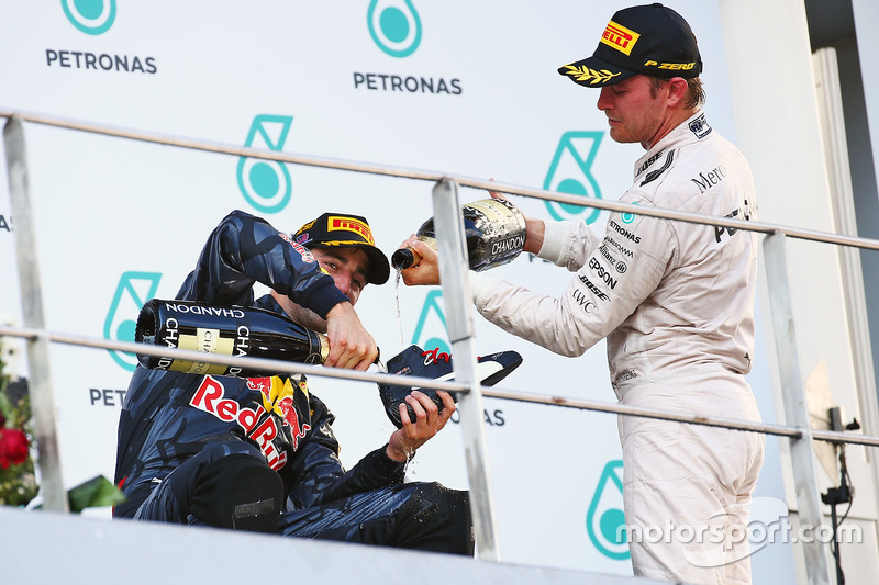 Race winner Daniel Ricciardo, Red Bull Racing celebrates on the podium with Nico Rosberg, Mercedes A