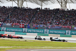 Lewis Hamilton, Mercedes AMG F1 W07 Hybrid leads at the start of the race as Nico Rosberg, Mercedes