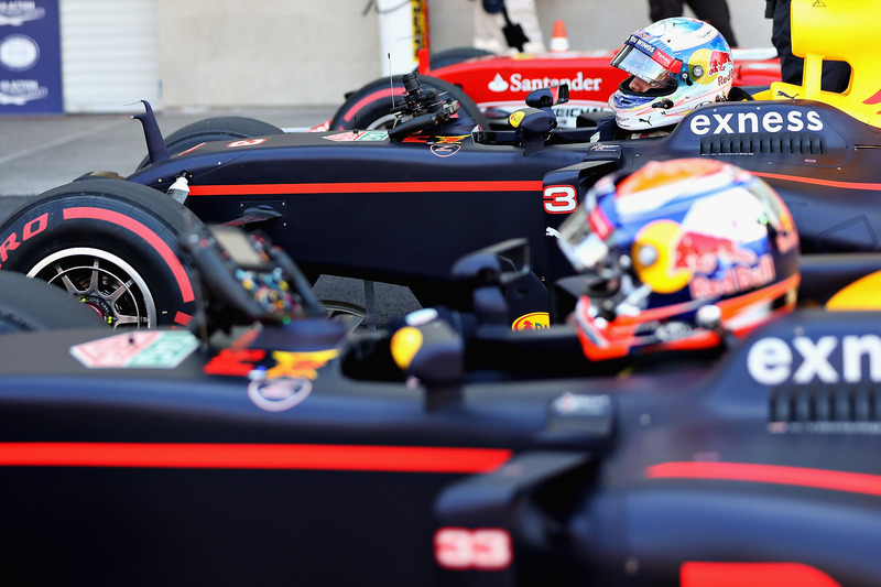 Fourth place qualifier Daniel Ricciardo, Red Bull Racing RB12 climbs out of his car next to team mat