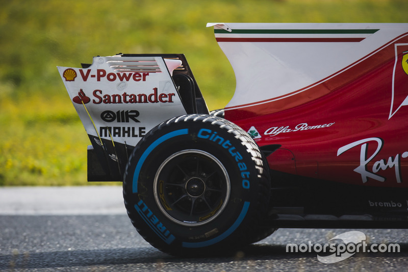 Kimi Raikkonen, Ferrari SF70H, Pirelli rear wheel, shark fin, and rear wing detail