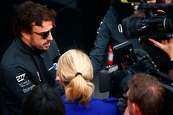 Fernando Alonso, McLaren, talks to the media in the paddock