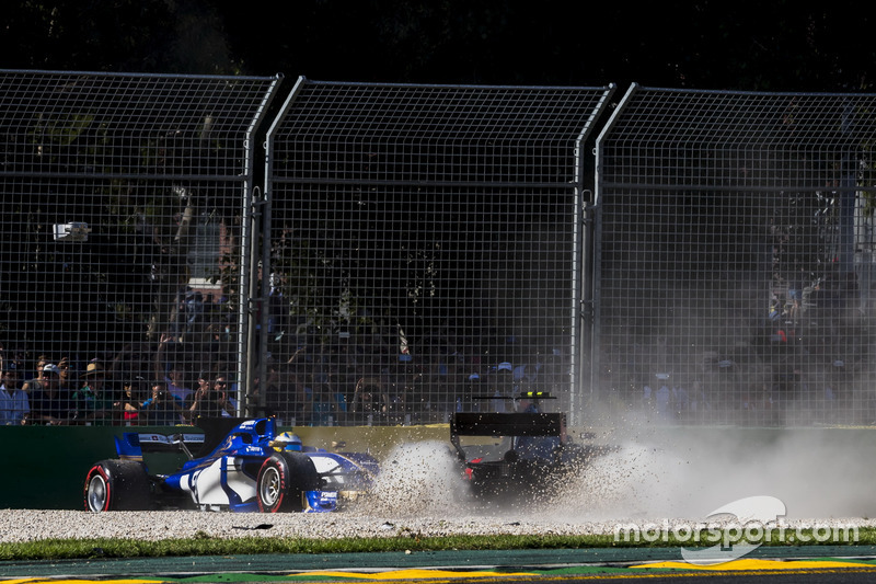 Kevin Magnussen, Haas F1 Team VF-17, collides with Marcus Ericsson, Sauber C36