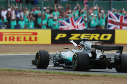 Lewis Hamilton, Mercedes AMG F1 W08, waves to the crowd after victory