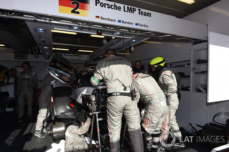 Crew members work on the #2 Porsche Team Porsche 919 Hybrid: Timo Bernhard, Earl Bamber, Brendon Hartley