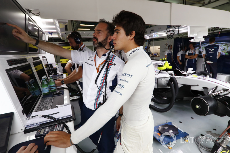 Lance Stroll, Williams, talks to his engineer