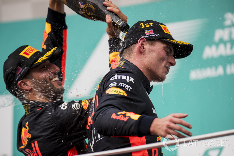 third place Daniel Ricciardo, Red Bull Racing, pours Champagne down the back of Max Verstappen, Red Bull Racing, race winner, on the podium
