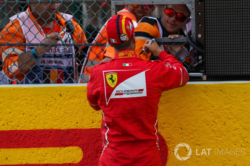 Sebastian Vettel, Ferrari signs autographs in parc ferme