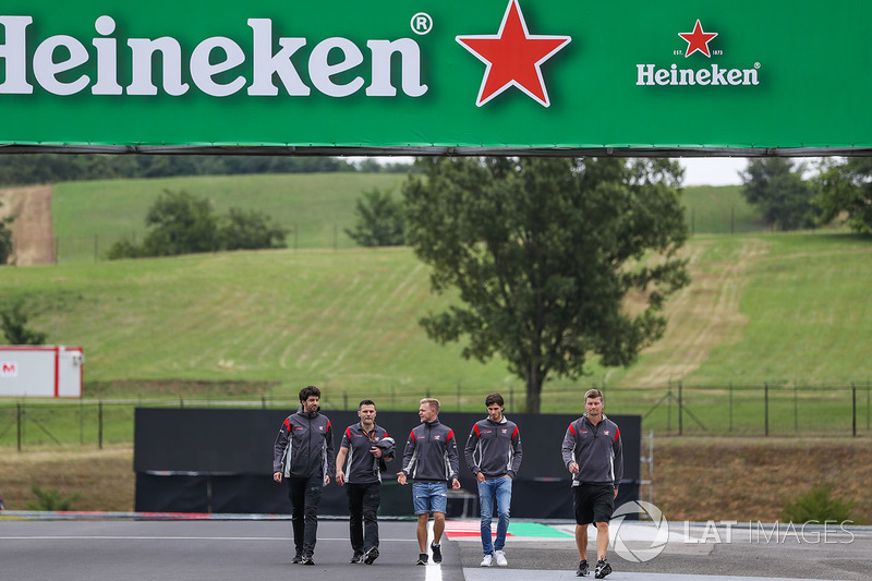 Antonio Giovinazzi, Haas F1 and Kevin Magnussen, Haas F1 walk the track