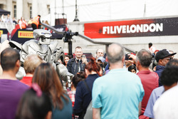 A robotic performer mingles, the crowd
