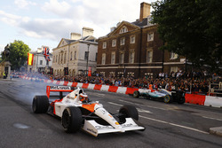 Stoffel Vandoorne, McLaren, takes a McLaren MP4/6 around as Valtteri Bottas, Mercedes AMG F1 W08, di