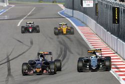 Carlos Sainz Jr., Scuderia Toro Rosso STR11 and Sergio Perez, Sahara Force India F1 VJM09