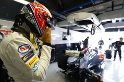 Jenson Button, McLaren puts on his helmet in the garage