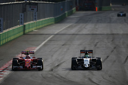 Kimi Raikkonen, Ferrari SF16-H and Nico Hulkenberg, Sahara Force India F1 VJM09 battle for position