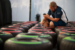 Williams mechanic with Pirelli tyres