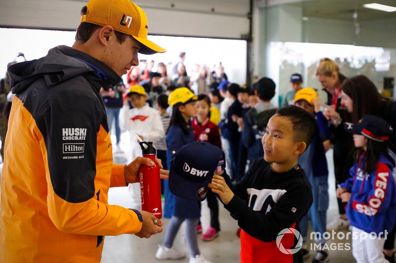 Lando Norris, McLaren with grid kids