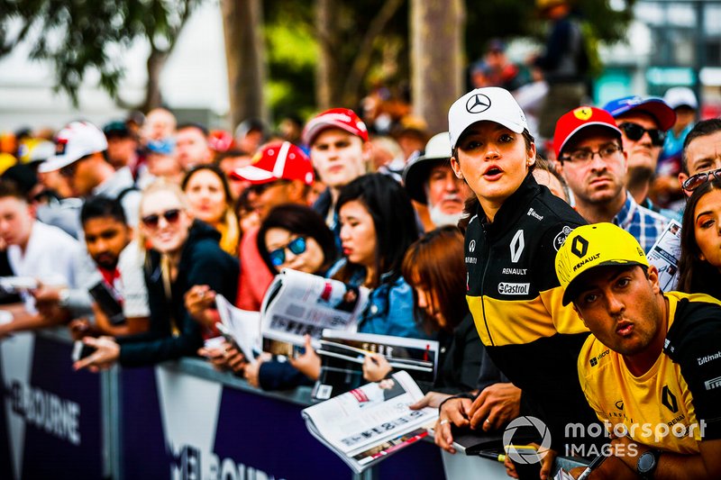 Fans wait for autographs from the drivers
