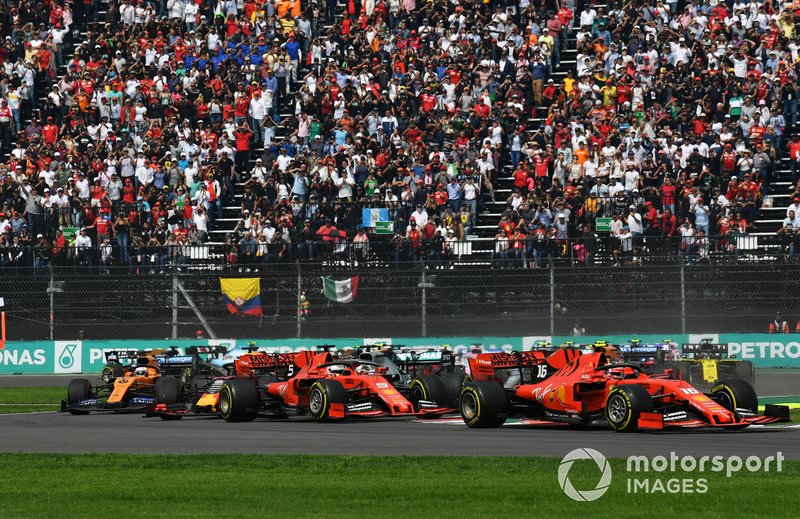 Charles Leclerc, Ferrari SF90, leads Sebastian Vettel, Ferrari SF90, Alexander Albon, Red Bull RB15, Lewis Hamilton, Mercedes AMG F1 W10, Max Verstappen, Red Bull Racing RB15, and the rest of the field at the start