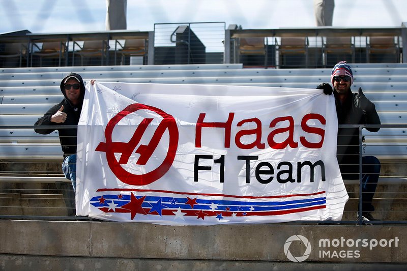 Fans hold a Haas banner