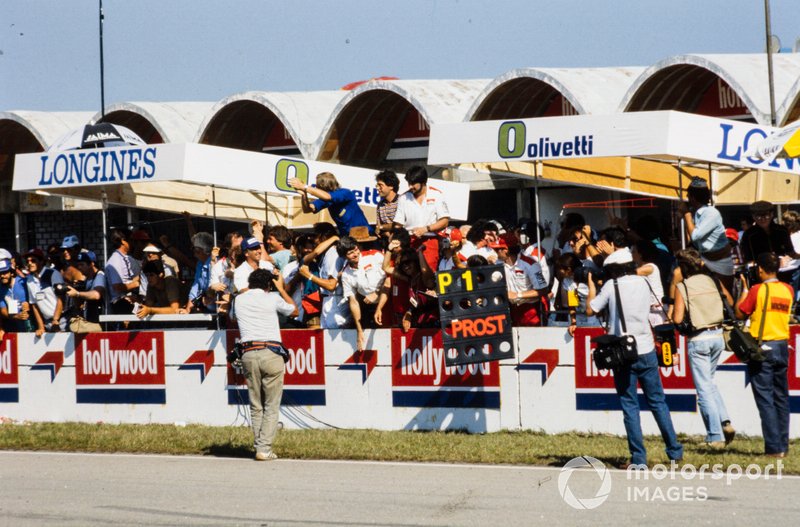 McLaren members celebrate Alain Prost's victory