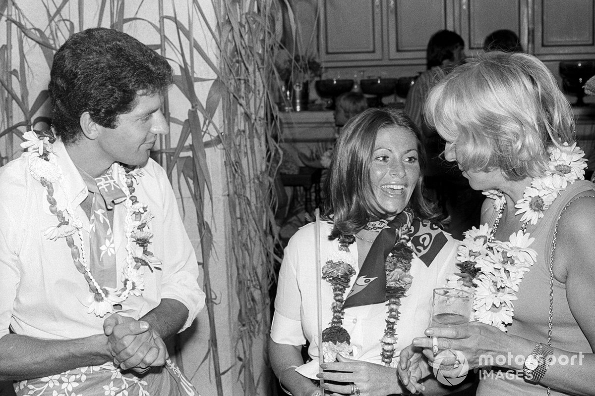 Jody Scheckter, Tyrrell, with wife Pam and Norah Tyrrell, wife of Ken Tyrrell, Tyrrell Team Owner, at a themed party