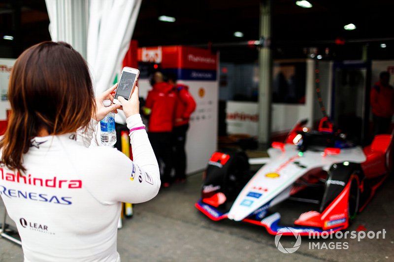 Katherine Legge, Mahindra Racing, takes a picture of her car in the garage