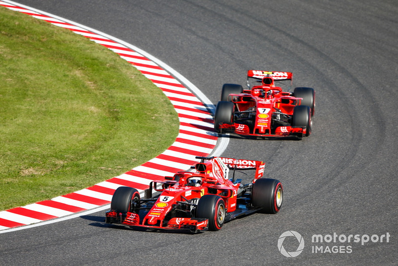 Sebastian Vettel, Ferrari SF71H, leads Kimi Raikkonen, Ferrari SF71H