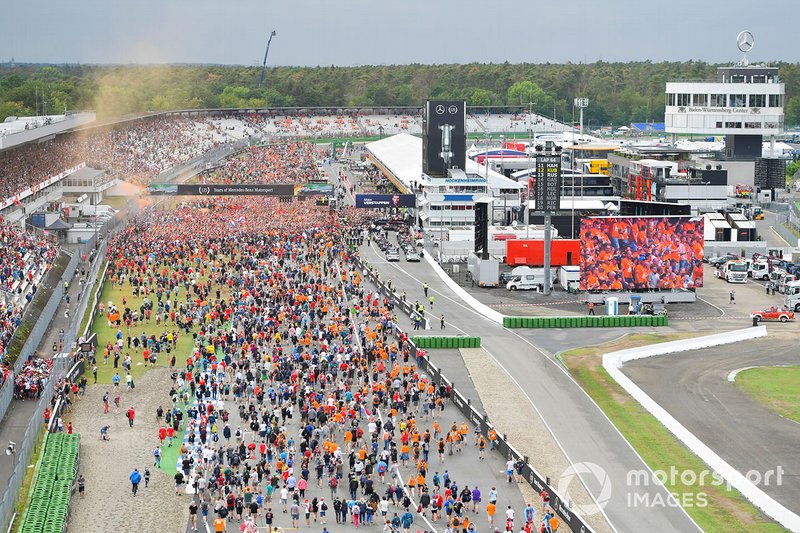 Fans invade the circuit in celebration at the end of the race