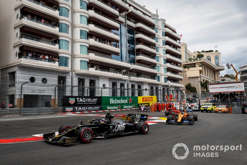 Romain Grosjean, Haas F1 Team VF-19, leads Lando Norris, McLaren MCL34, and Charles Leclerc, Ferrari SF90