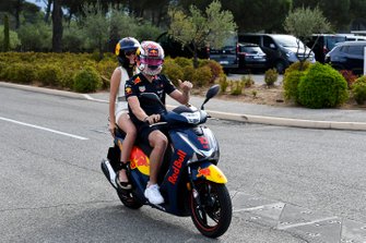 Pierre Gasly, Red Bull Racing arrives with his girlfriend Caterina Masetti Zannini on his moped