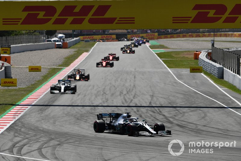 Lewis Hamilton, Mercedes AMG F1 W10, leads Valtteri Bottas, Mercedes AMG W10, and Max Verstappen, Red Bull Racing RB15