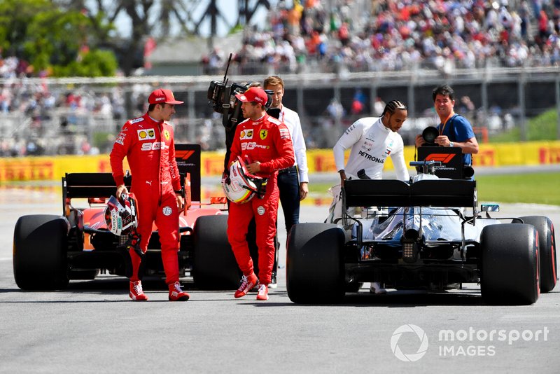 Charles Leclerc, Ferrari, talks with pole man Sebastian Vettel, Ferrari, after Qualifying