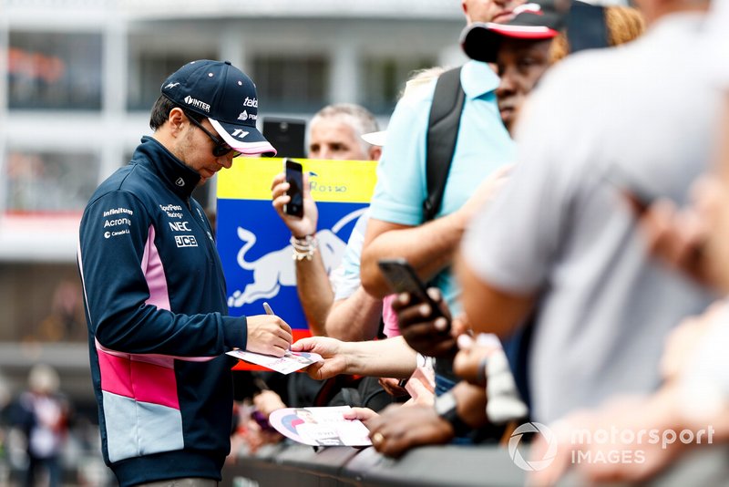 Sergio Perez, Racing Point signs a autograph for a fan