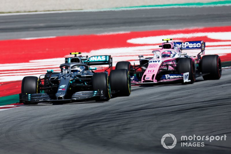 Valtteri Bottas, Mercedes AMG W10, leads Lando Norris, McLaren MCL34