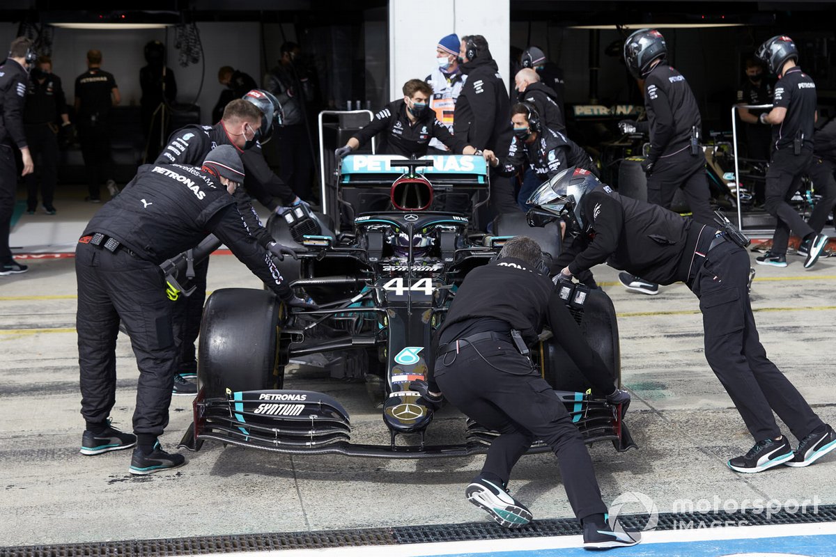 Lewis Hamilton, Mercedes F1 W11, is returned to the garage