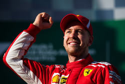 Race winner Sebastian Vettel, Ferrari celebrates on the podium