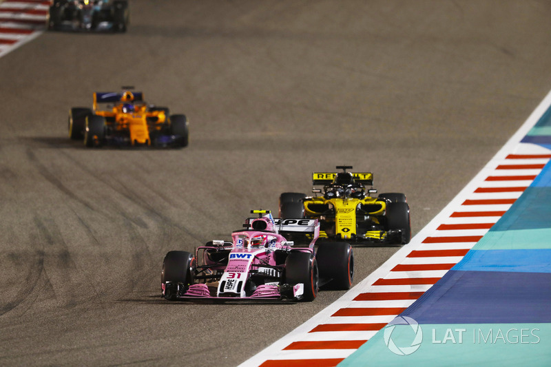 Esteban Ocon, Force India VJM11 Mercedes, leads Nico Hulkenberg, Renault Sport F1 Team R.S. 18, and 