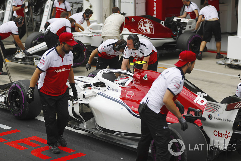 Charles Leclerc, Sauber C37, and Marcus Ericsson, Sauber C37, stop in the Sauber pit area