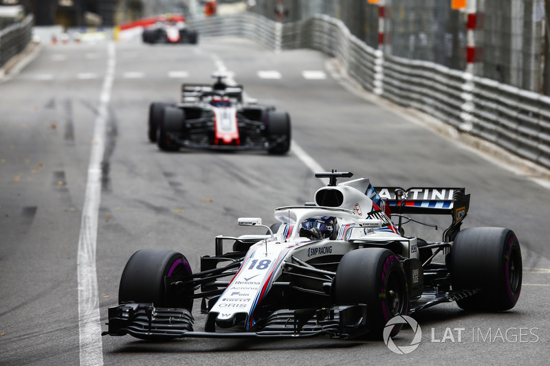 Lance Stroll, Williams FW41, leads Romain Grosjean, Haas F1 Team VF-18
