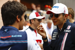 Esteban Ocon, Force India, talks to Lance Stroll, Williams Racing