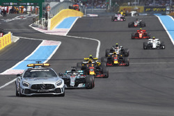 The Safety Car leads Lewis Hamilton, Mercedes AMG F1 W09, Max Verstappen, Red Bull Racing RB14, Daniel Ricciardo, Red Bull Racing RB14, and the rest of the field