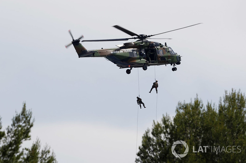 Pre-race entertainment as soldiers abseil from a helicopter