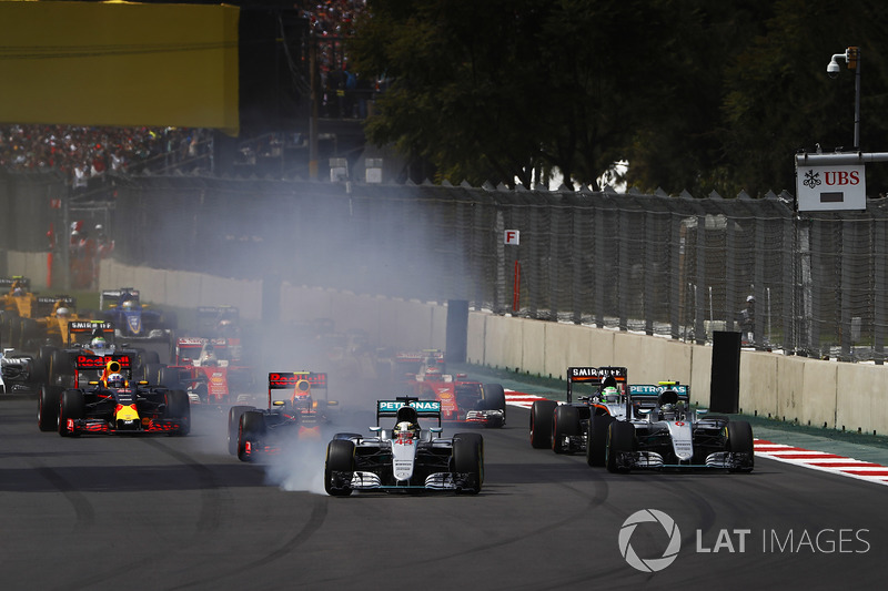 Lewis Hamilton, Mercedes F1 W07 Hybrid, locks a brake at the start as he leads Nico Rosberg, Mercede