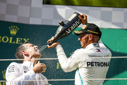 Lewis Hamilton, Mercedes AMG F1, 1st position, celebrates with his team mate on the podium