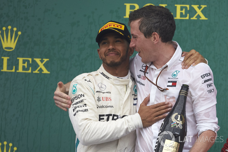 Lewis Hamilton, Mercedes AMG F1, 1st position, with the Mercedes Constructors trophy delegate on the podium