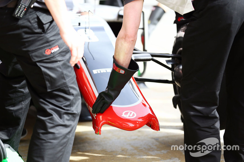 The Haas VF-16 of Romain Grosjean, Haas F1 Team with a broken front wing