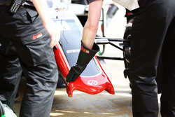 The Haas VF-16 of Romain Grosjean, Haas F1 Team with a broken front wing